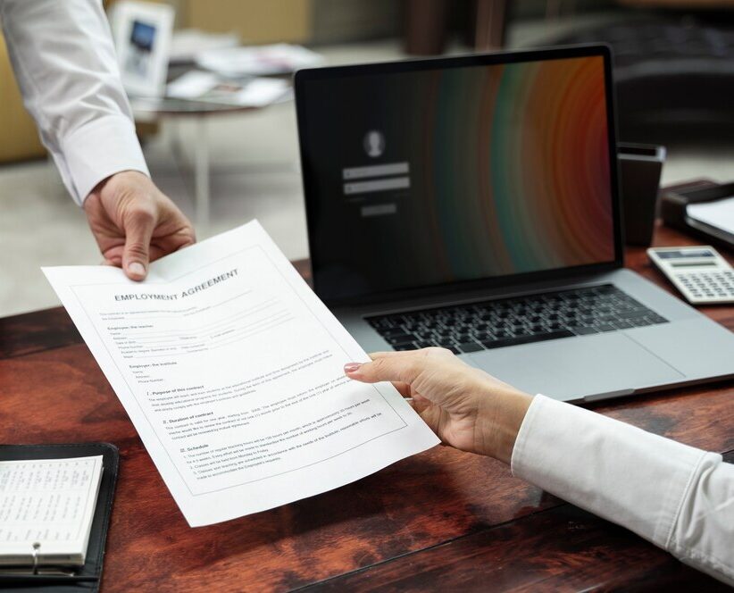 high-angle-hands-holding-document_23-2149445755