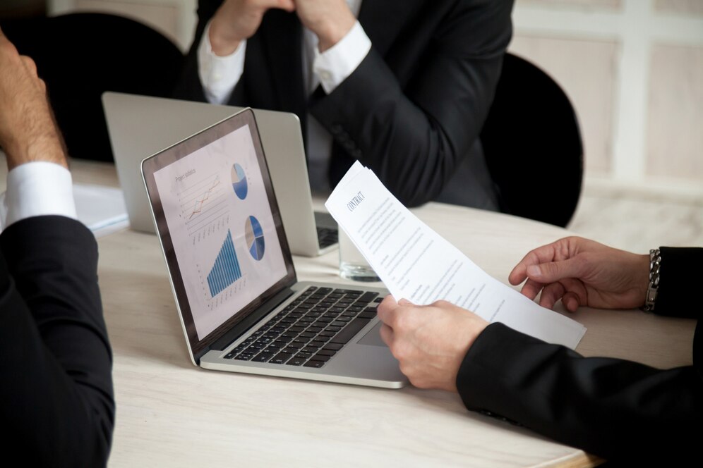 negotiations-contract-meeting-three-partners-close-up_1163-3916